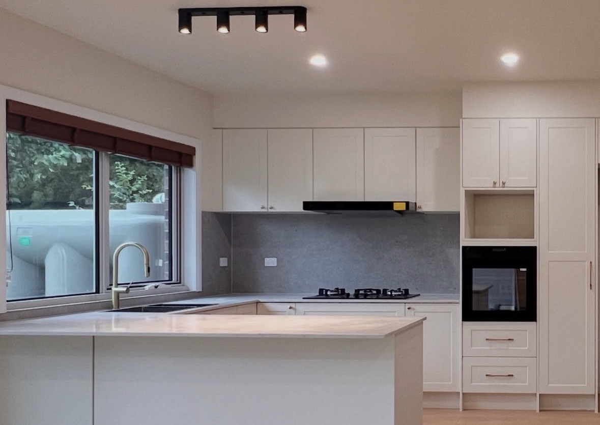 Renovated kitchen with shaker joinery and integrated appliances